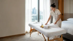 Clean folded towels and massage oil set out before a professional massage session in Bangkok